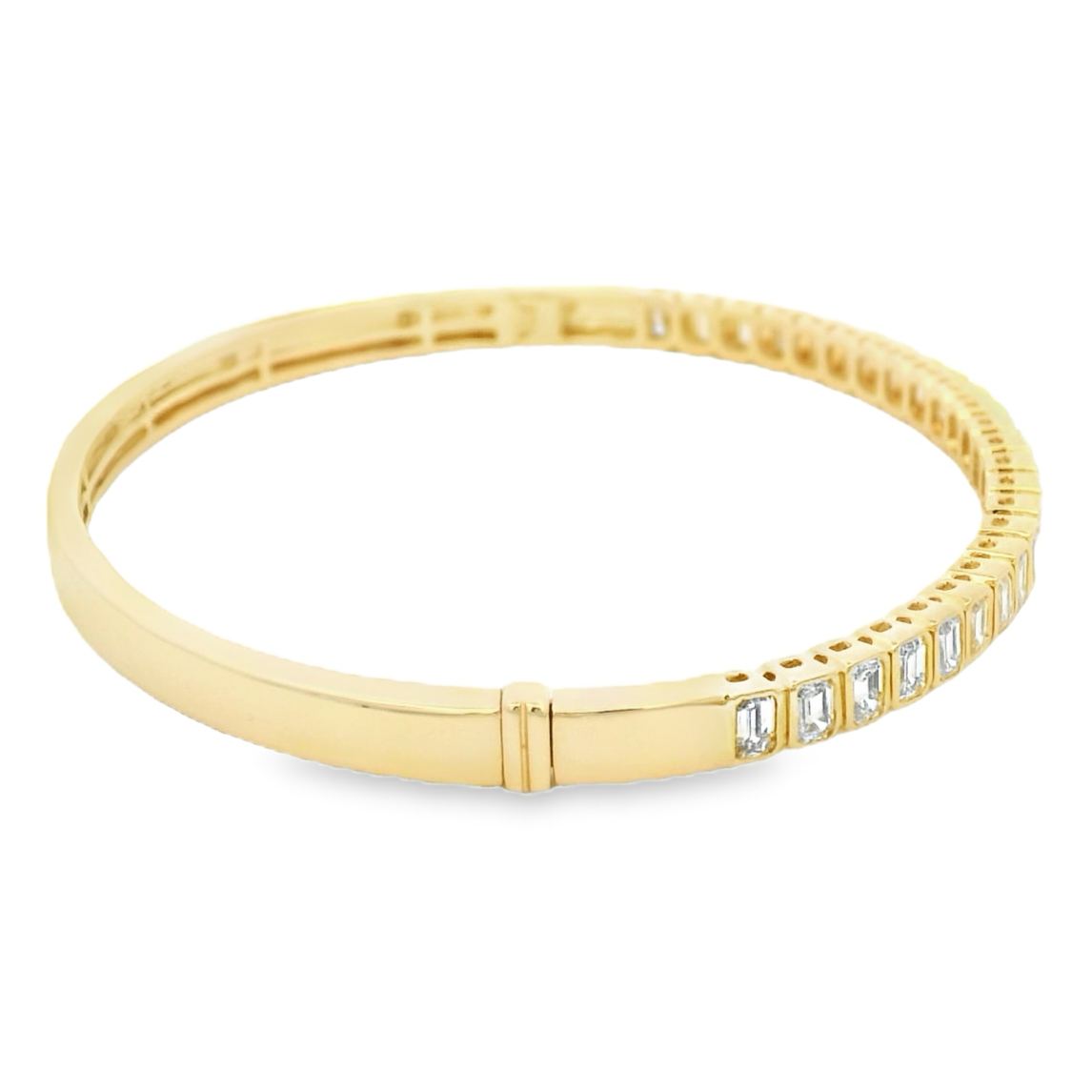 18K yellow and white gold emerald cut diamond bangle with a sleek halfway setting.