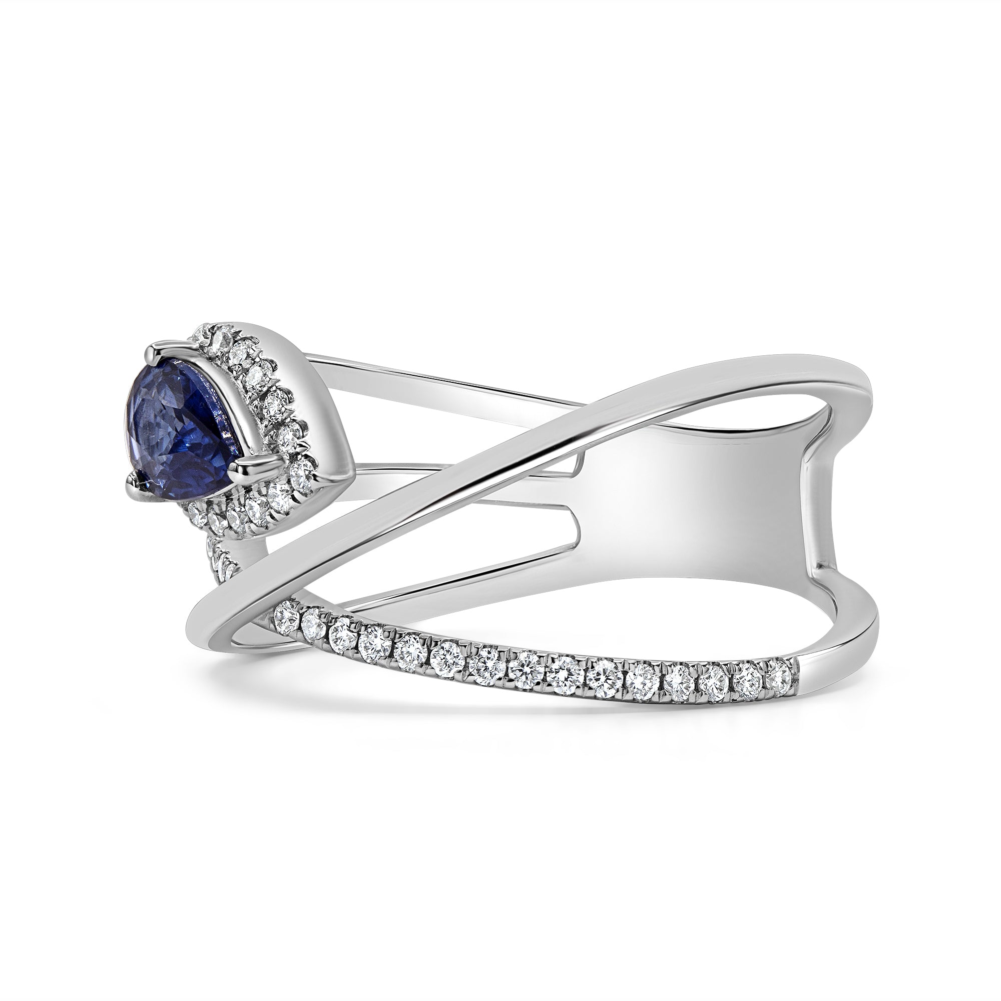Blue sapphire and diamond X ring in 14K gold featuring a pear-shaped sapphire with round brilliant diamond accents in an elegant crossover design.