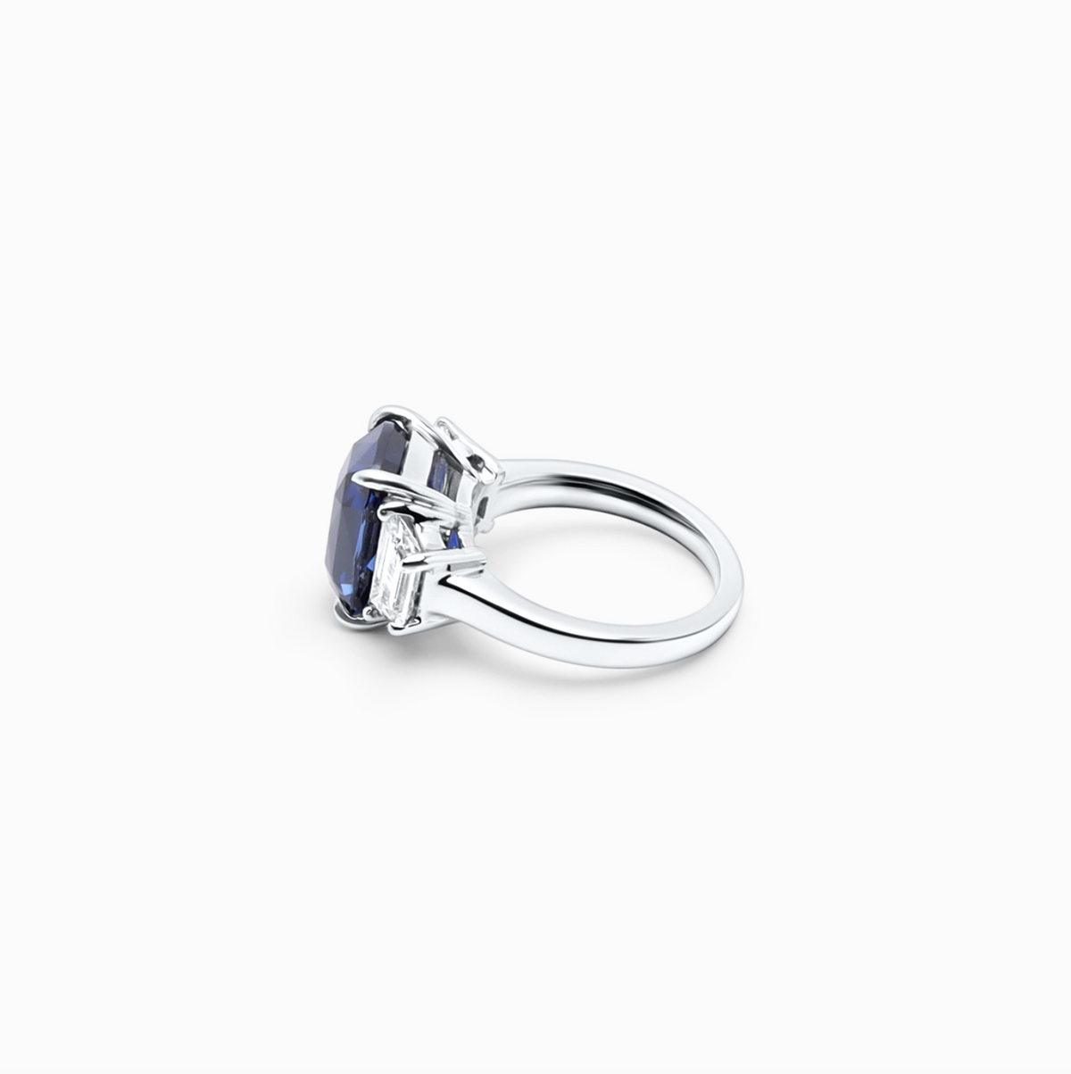 Elegant radiant shape sapphire and diamond engagement ring with a 7.71 carat sapphire center.