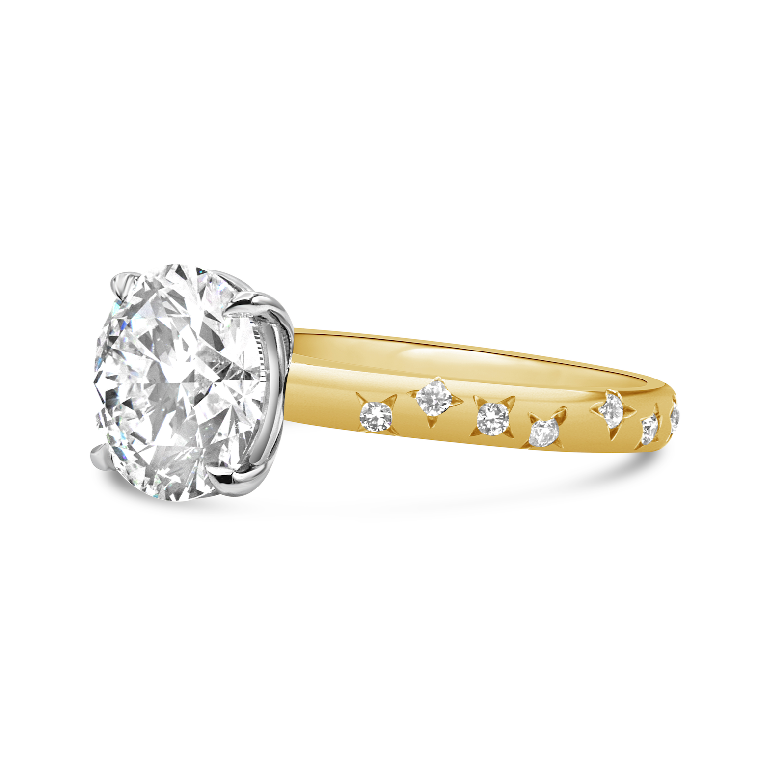 Star Gazer ring featuring a round diamond center stone in platinum and 18K yellow gold with diamond accent details.