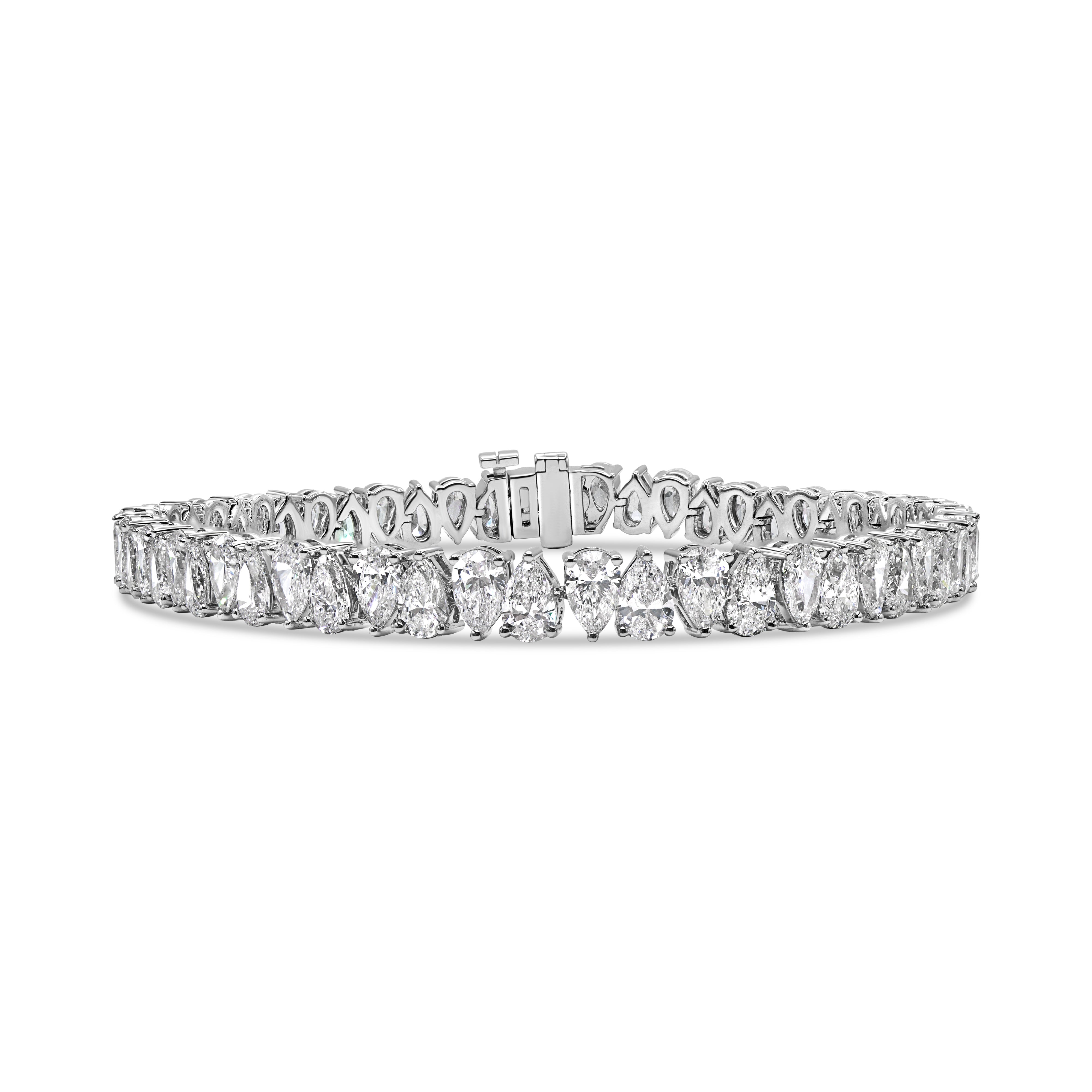 14K gold tennis bracelet featuring side-to-side lab-grown pear-shaped diamonds in a modern design.