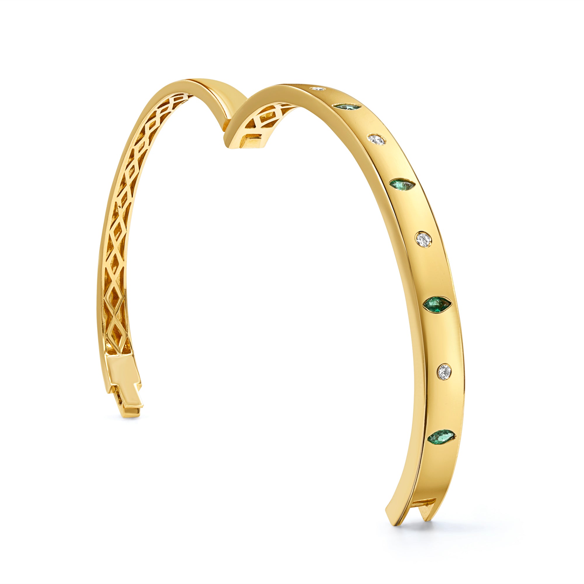 Green emerald and diamond inlay bangle in 14K gold featuring emeralds and round diamonds in an elegant, modern statement design.