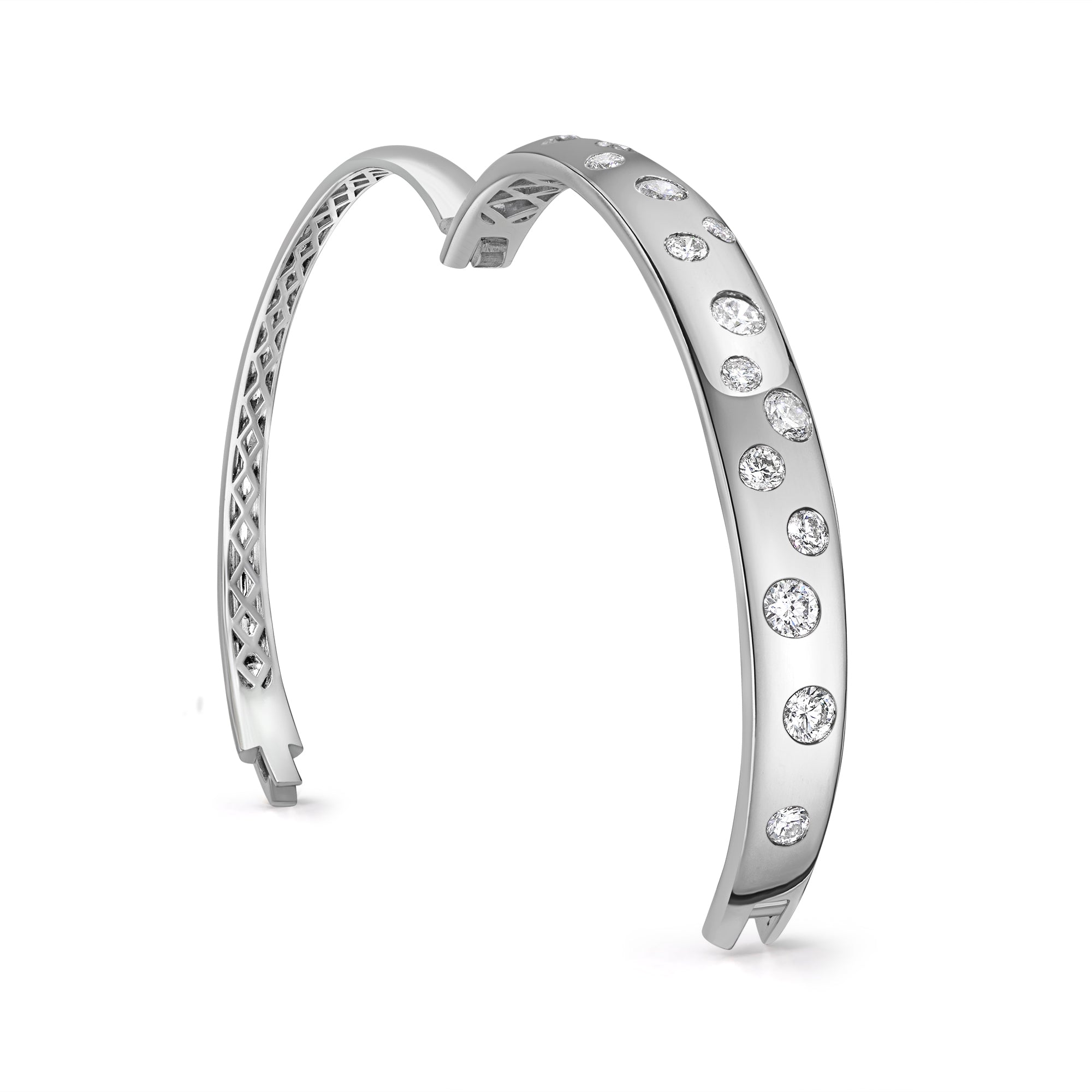 Scattered diamond bangle in 14K gold featuring prong-set round diamonds in a modern, luxurious statement design.
