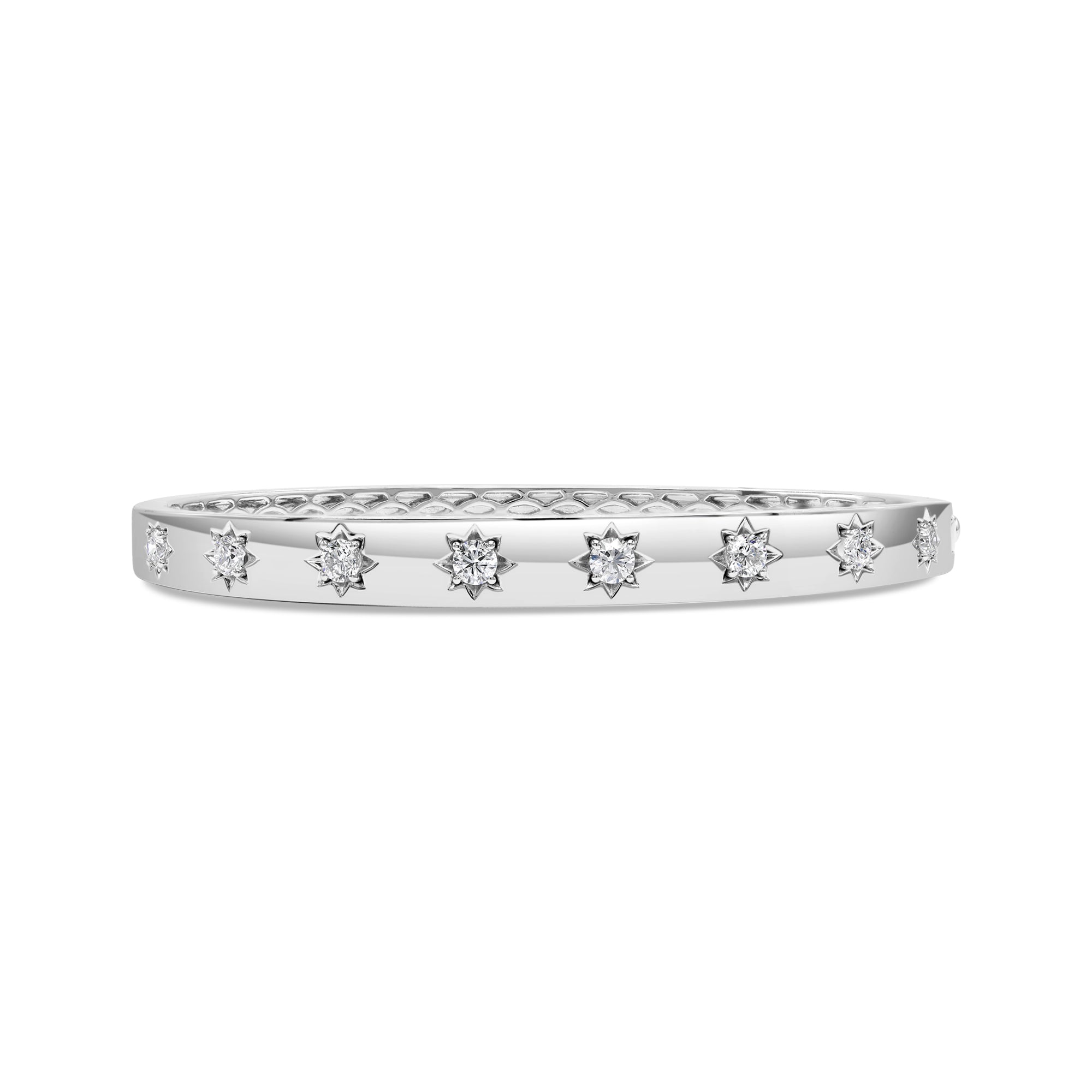Starburst diamond bangle in 14K white gold featuring round diamonds in celestial star-engraved settings with a modern design.