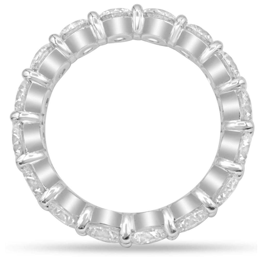 Platinum diamond eternity band featuring 18 brilliant round diamonds totaling 2.98 carats.