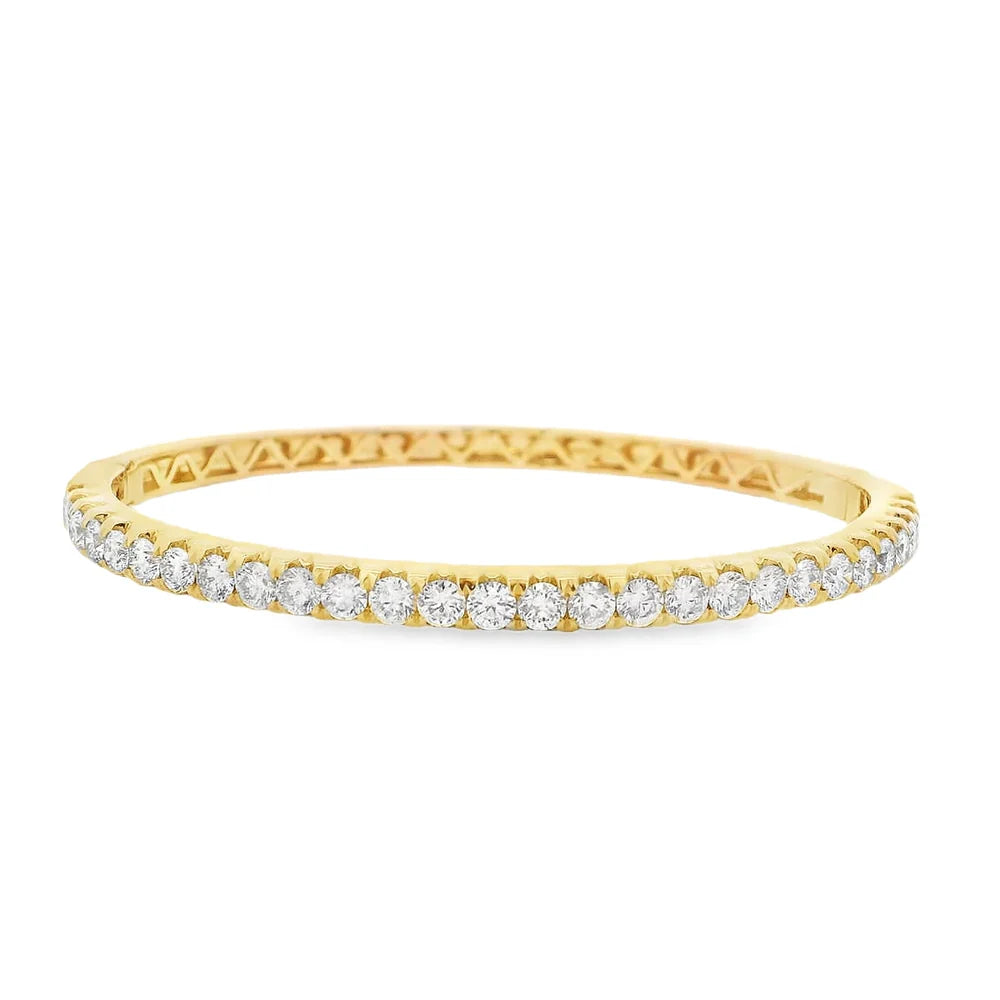 Halfway round diamond bangle available in 18K yellow, white, or rose gold featuring diamonds in a versatile half-pavé design.